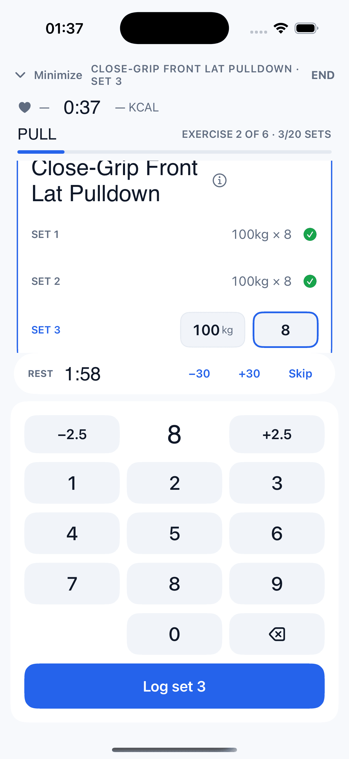 Live workout — logging a set with rest timer and weight keypad.